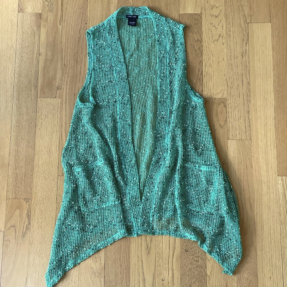 Katie Todd Knit shawl. Handkerchief hemline. Green and white slub texture.